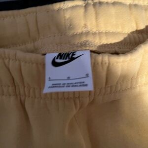 Men’s yellow Nike joggers